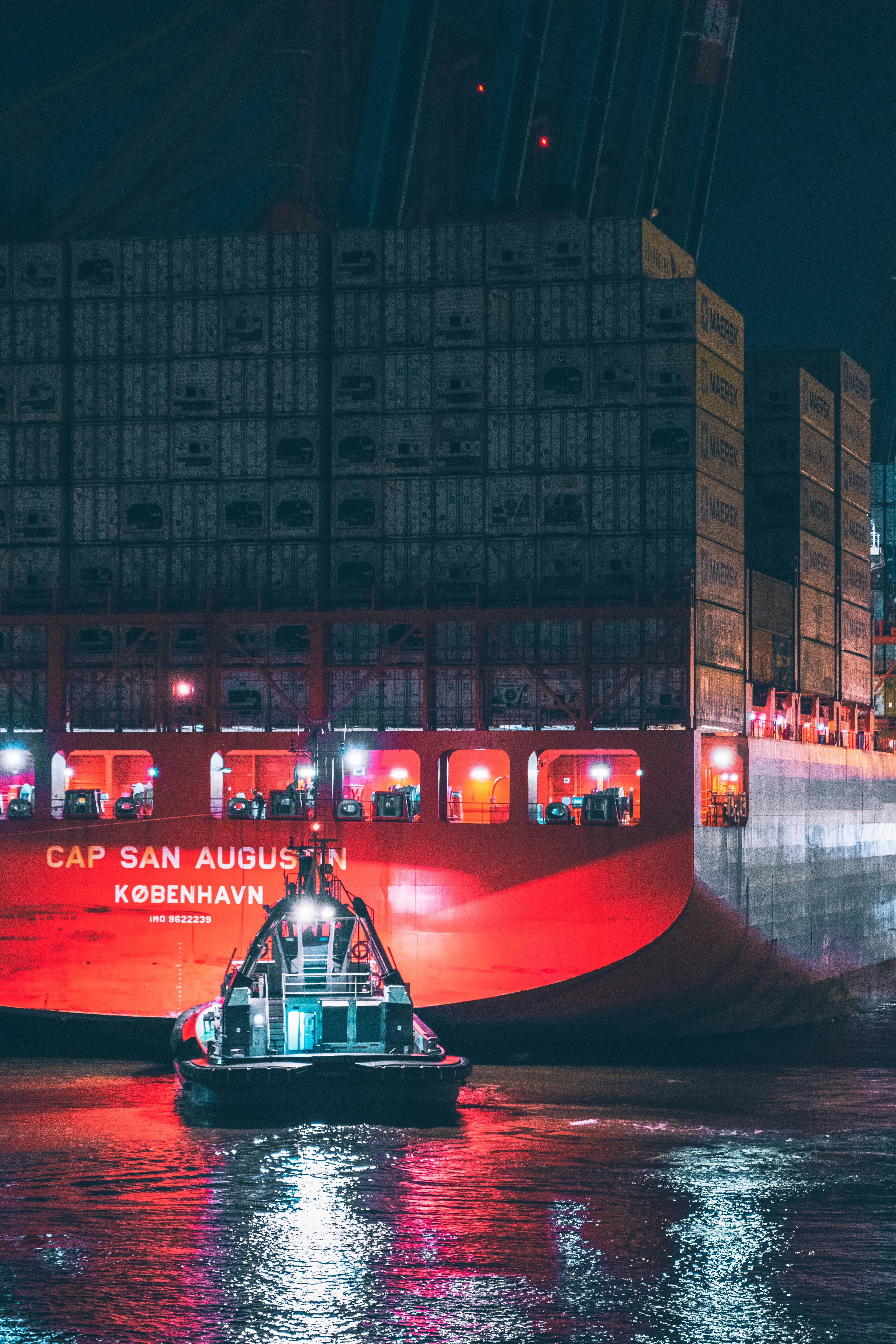 red and black boat on water